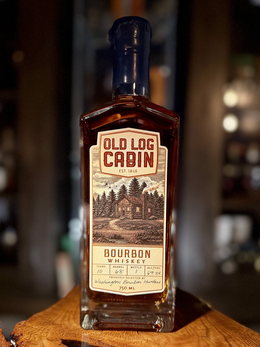 Old Log Cabin bourbon whiskey bottle with blue wax top